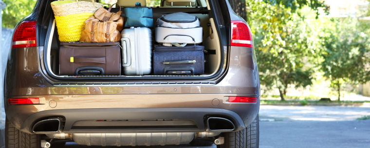 Car ready for staycation with luggage loaded in boot