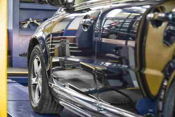 Car doors on a black car being checked in an MOT test