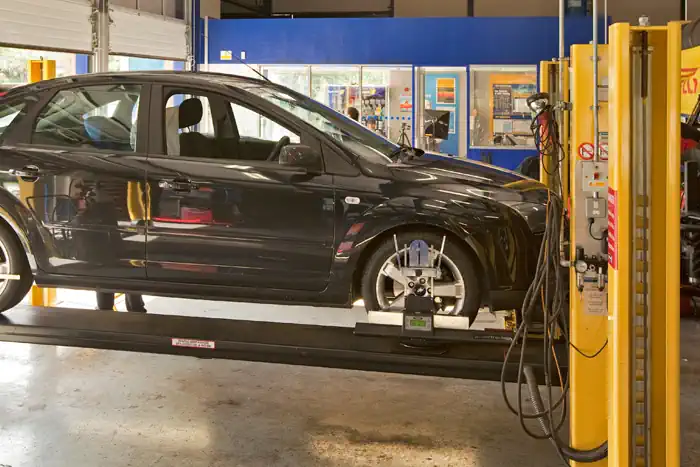 Car on ramp in Kwik Fit centre